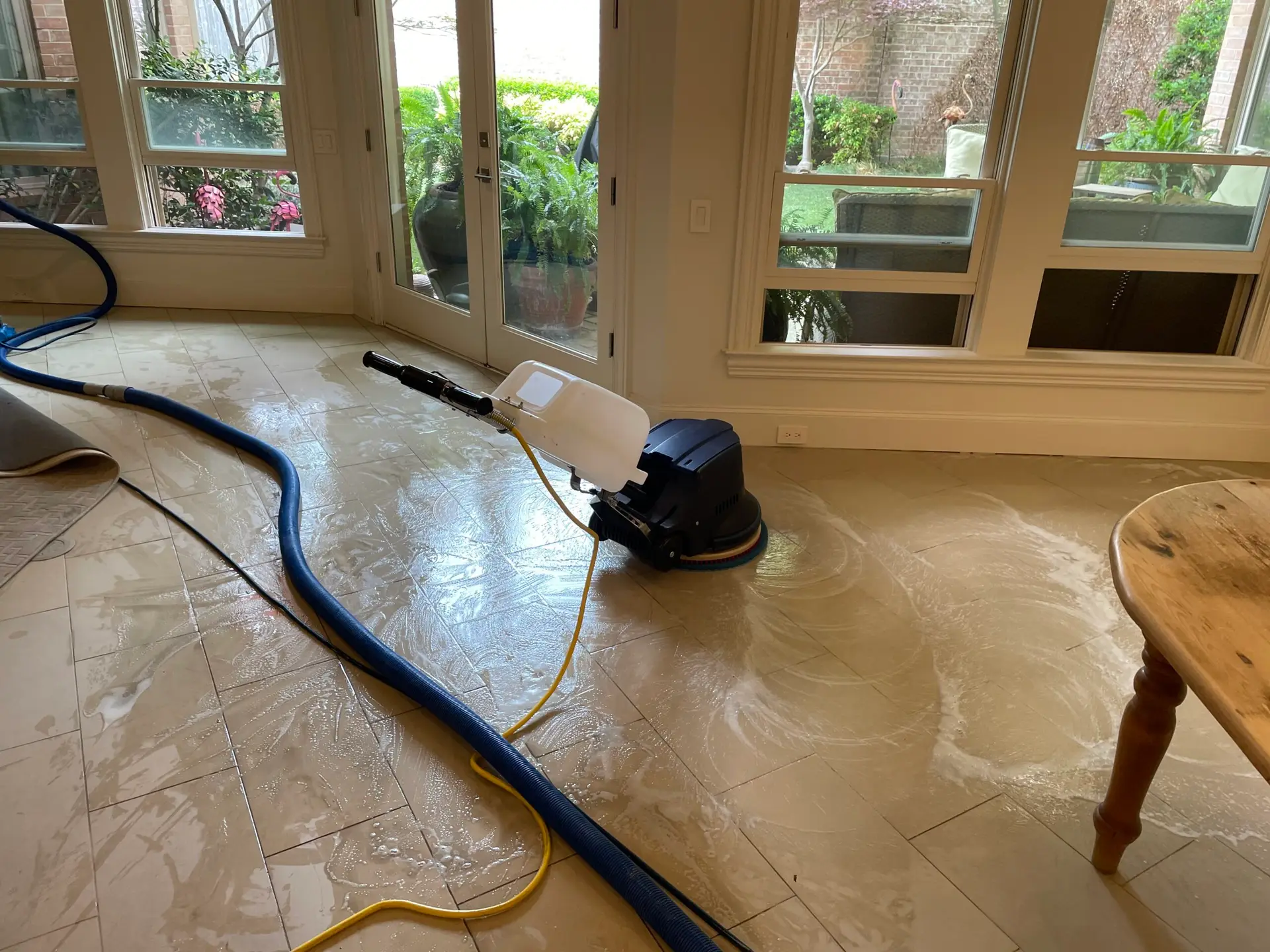 Rotary extraction lifts embedded soil from tile and grout