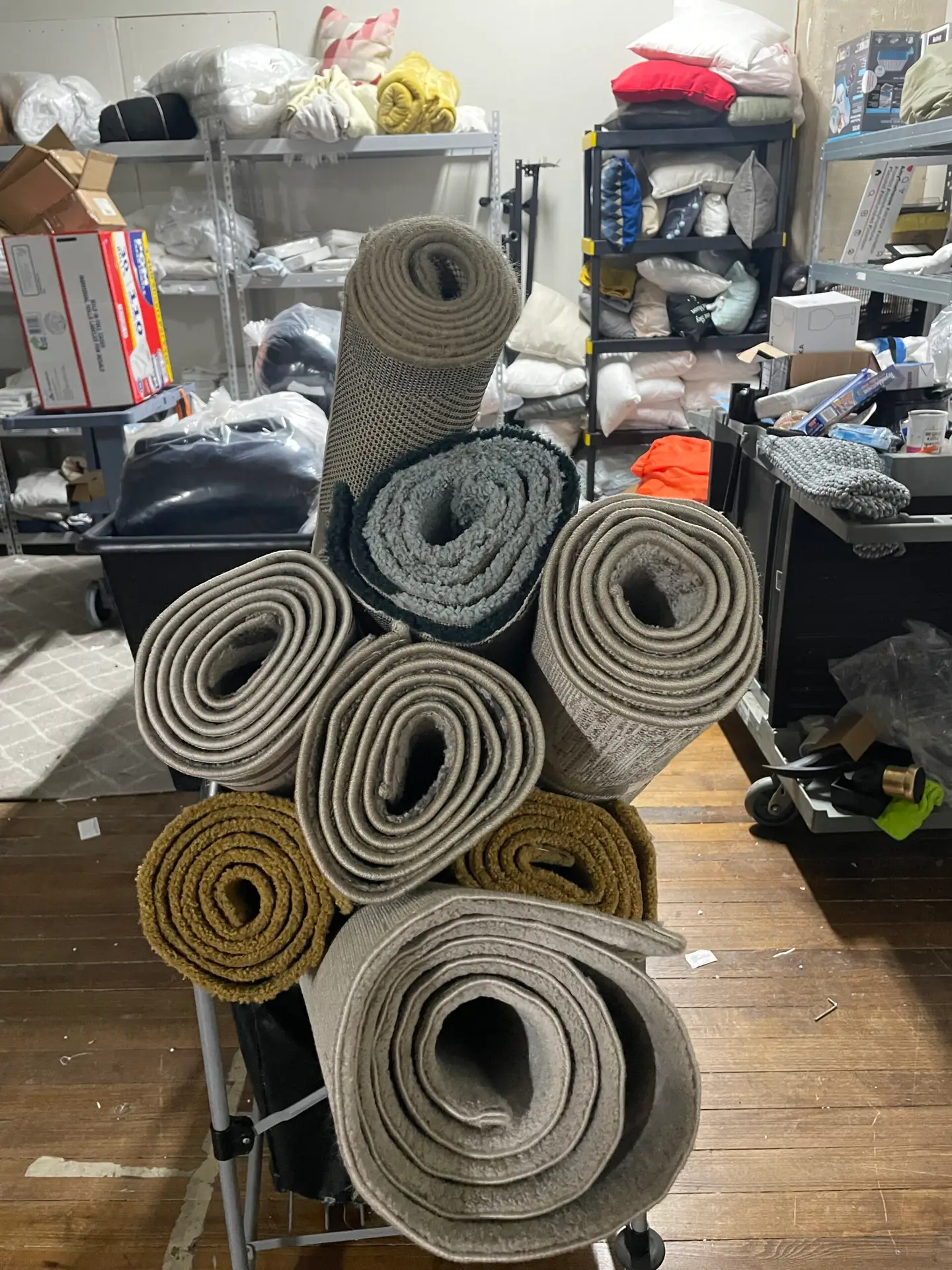 Dallas area rug pick-up and delivery—technician rolling rug for transport