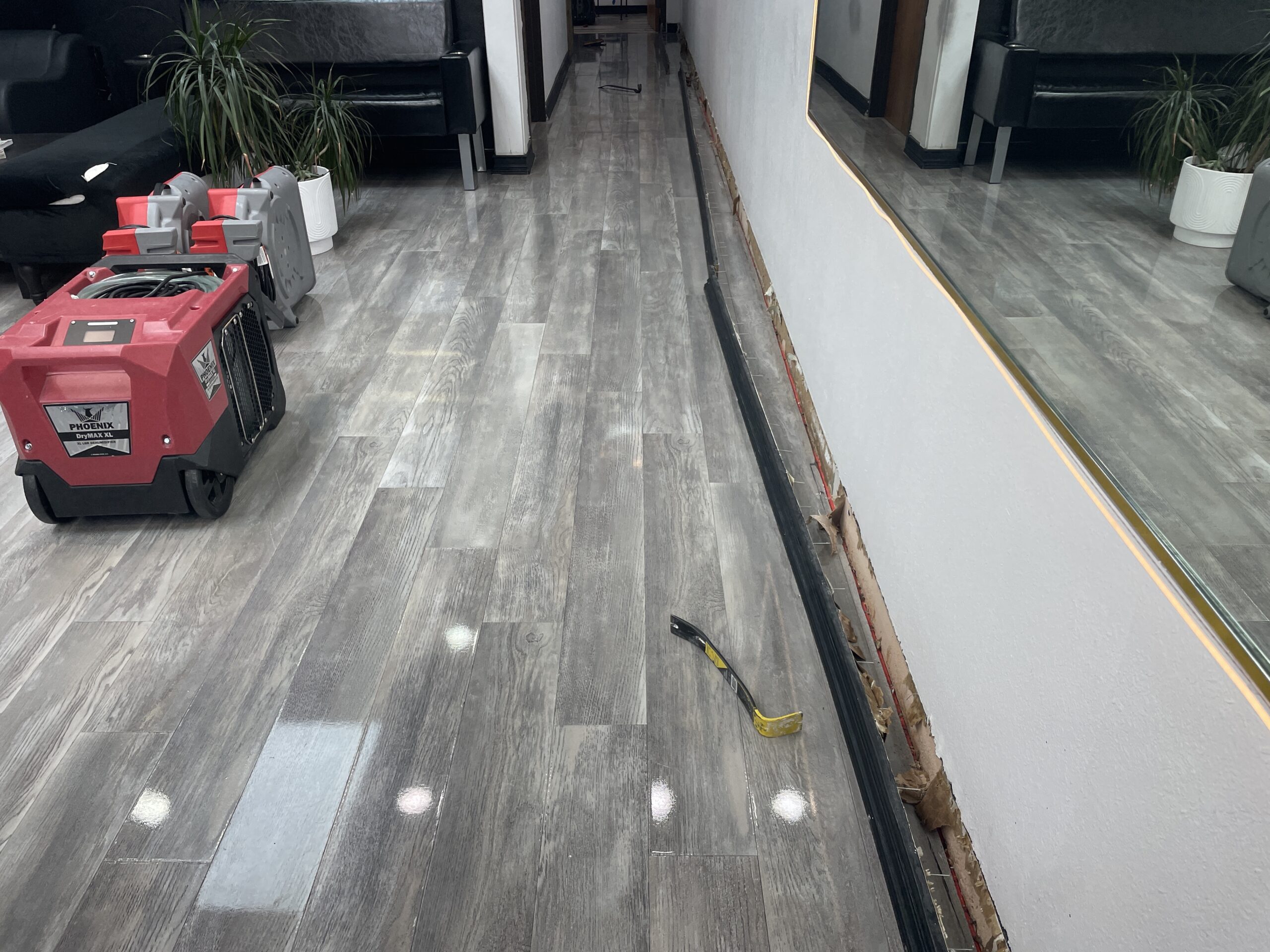 Controlled removal of wet drywall during Dallas water mitigation