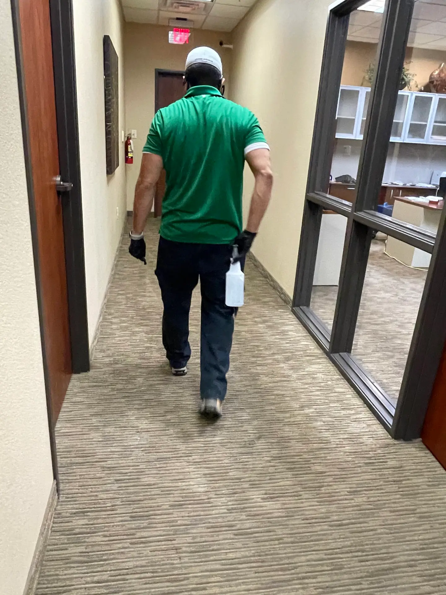Technician verifying Dallas odor removal results with readings
