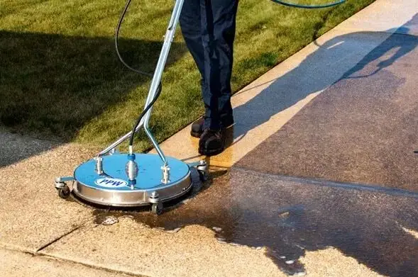 Pressure washing driveway with rotary surface cleaner